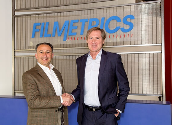 Filmetrics and KLA executives shaking hands