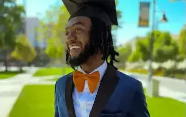 A person putting a mask on a child.